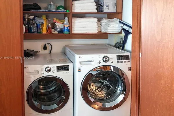 a utility room with dryer and washer