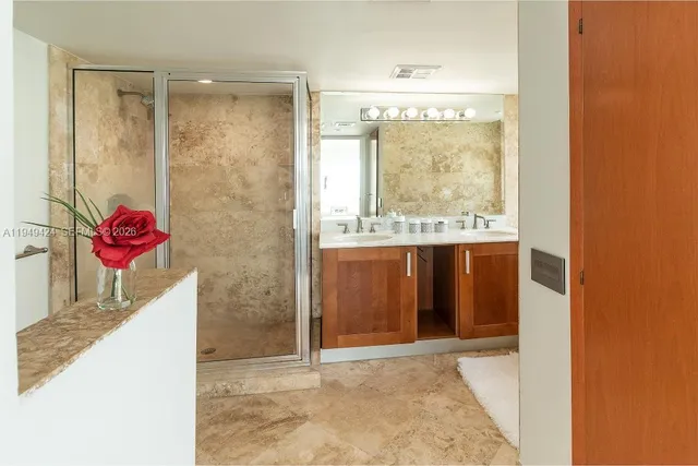 a view of a bathroom with a sink and a vanity