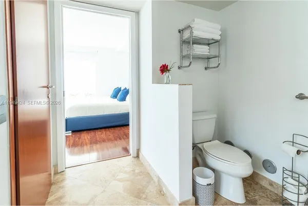 a bathroom with a toilet and a sink