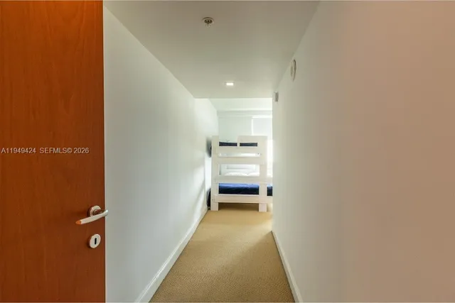 a view of a hallway with a bedroom