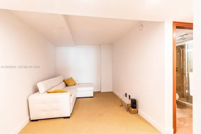 a bed room with a bed and a window