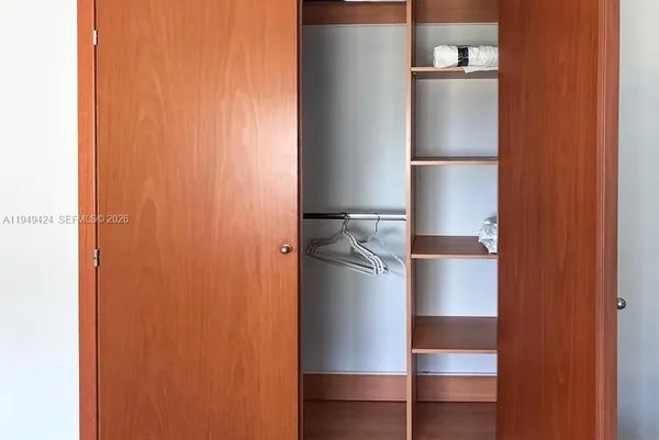 a bathroom with a toilet a sink and shower