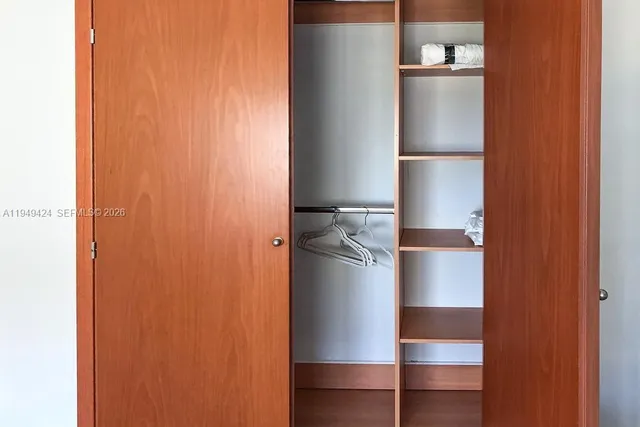 a bathroom with a toilet a sink and shower