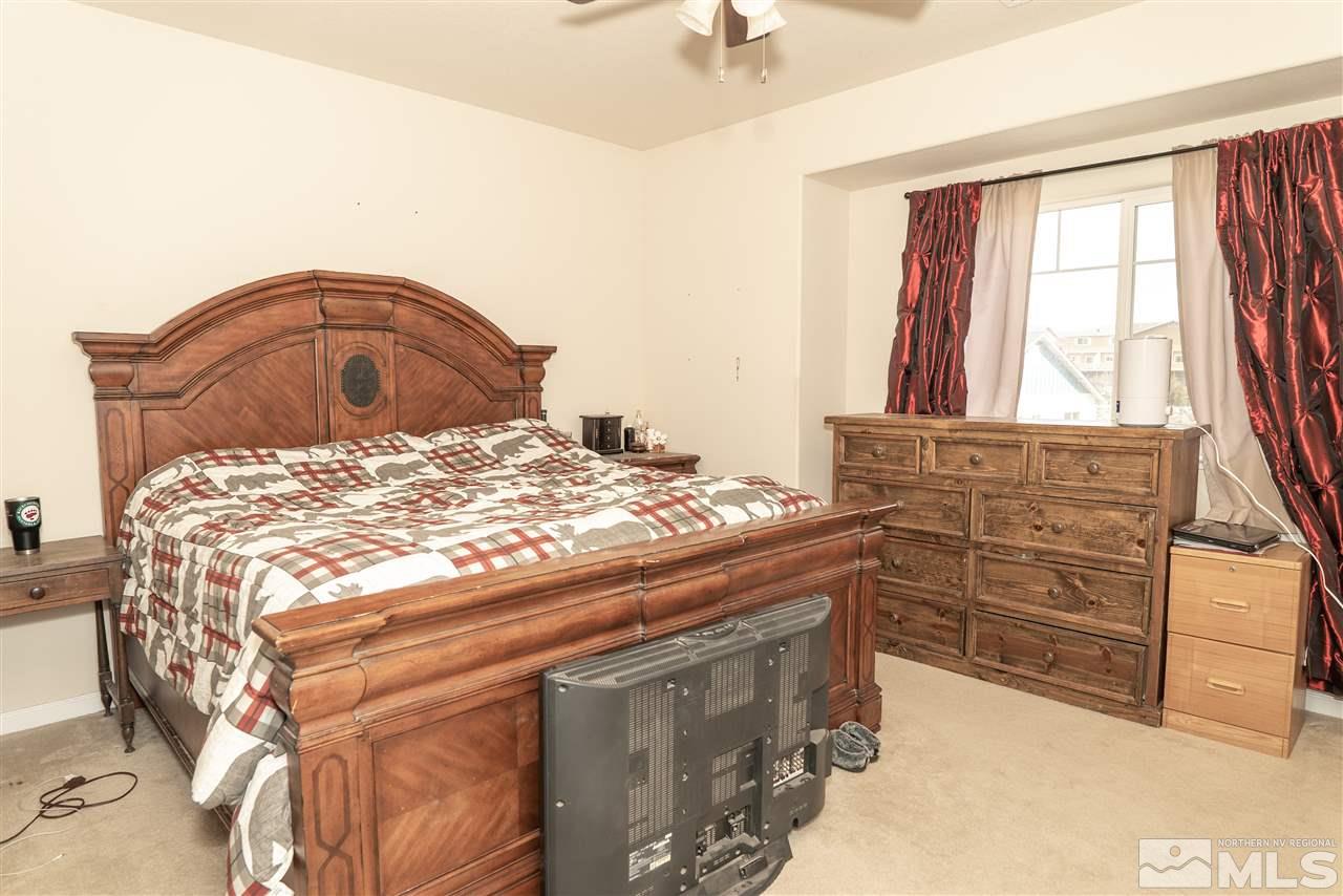 4805 Ciarra Kennedy Lane Reno, NV 89503 - Photo 8 of 16 a bedroom with a bed and a dresser