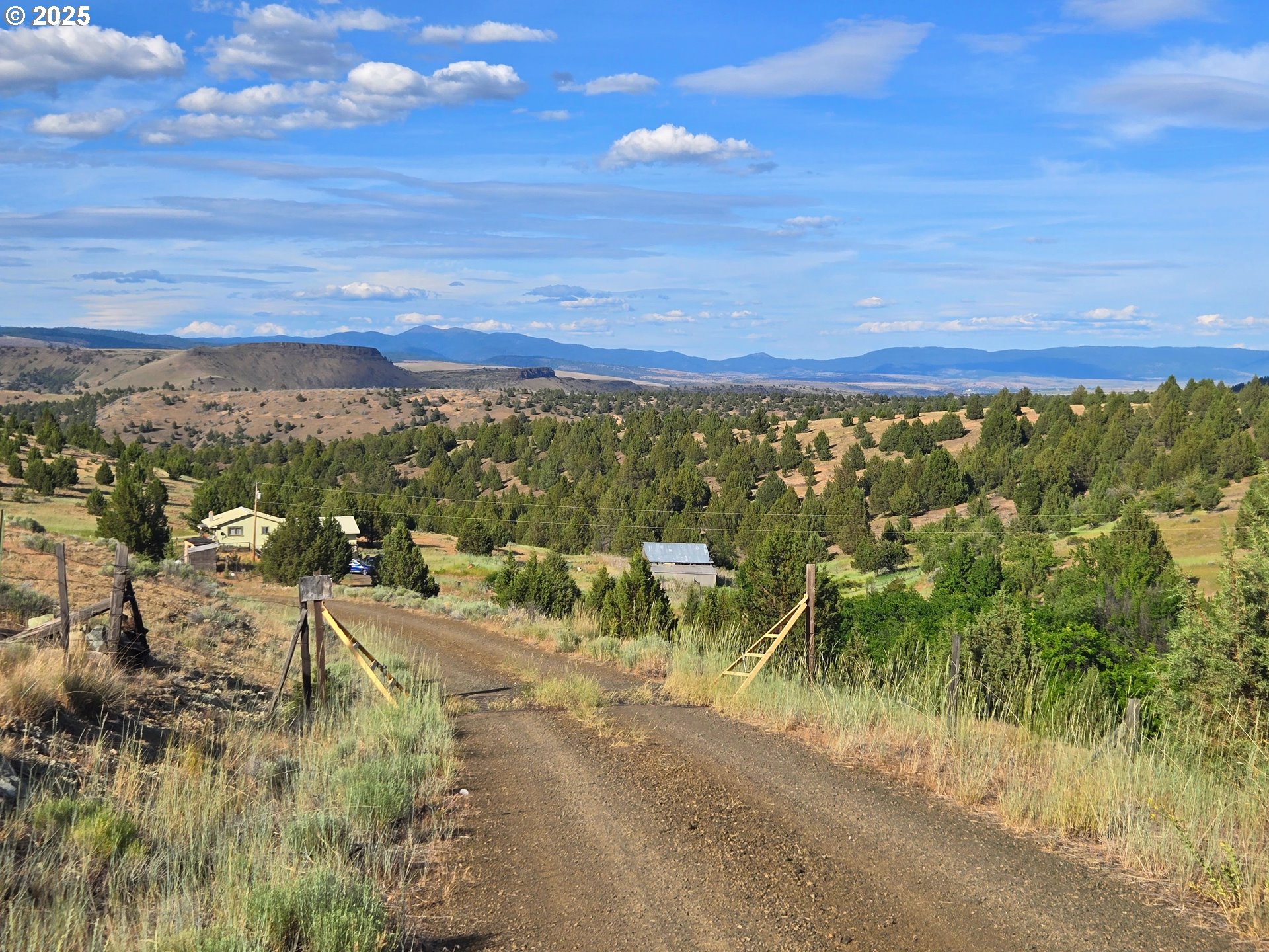 26113 West Bench Road John Day, OR 97845 - Photo 15 of 17 a view of a city with lots of trees