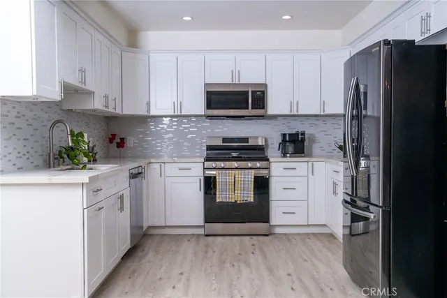 a kitchen with a table chairs and a stove