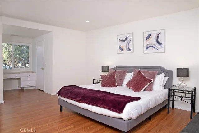 a bedroom with a bed and a lamp