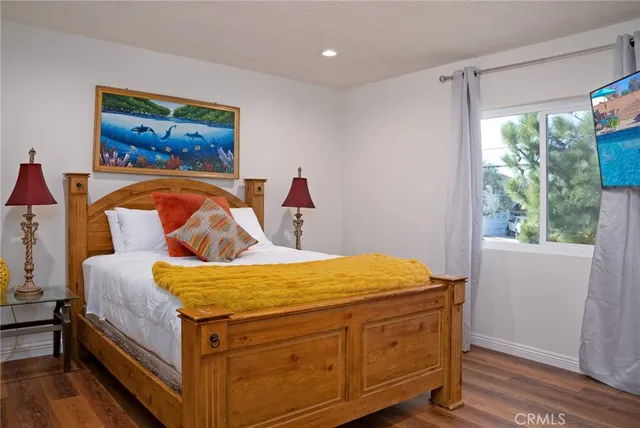 a view of a dining room with furniture and a potted plant