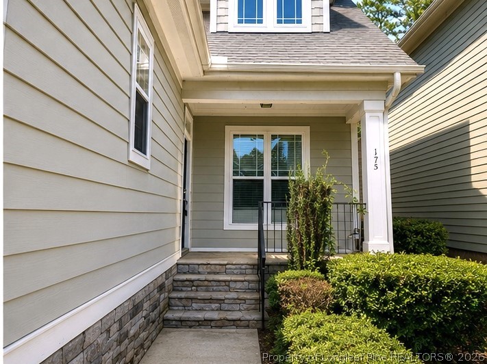 175 Pine Hawk Drive Spring Lake, NC 28390 - Photo 6 of 43 a front view of a house with a garden