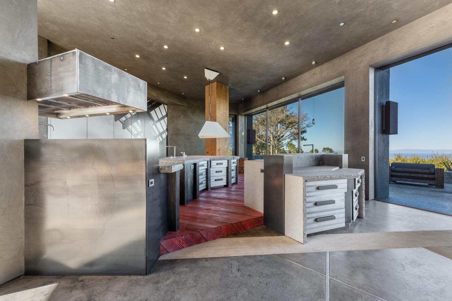 566 Aguajito Road Carmel, CA 93923 - Photo 11 of 78 a kitchen with stainless steel appliances kitchen island granite countertop a refrigerator and a stove