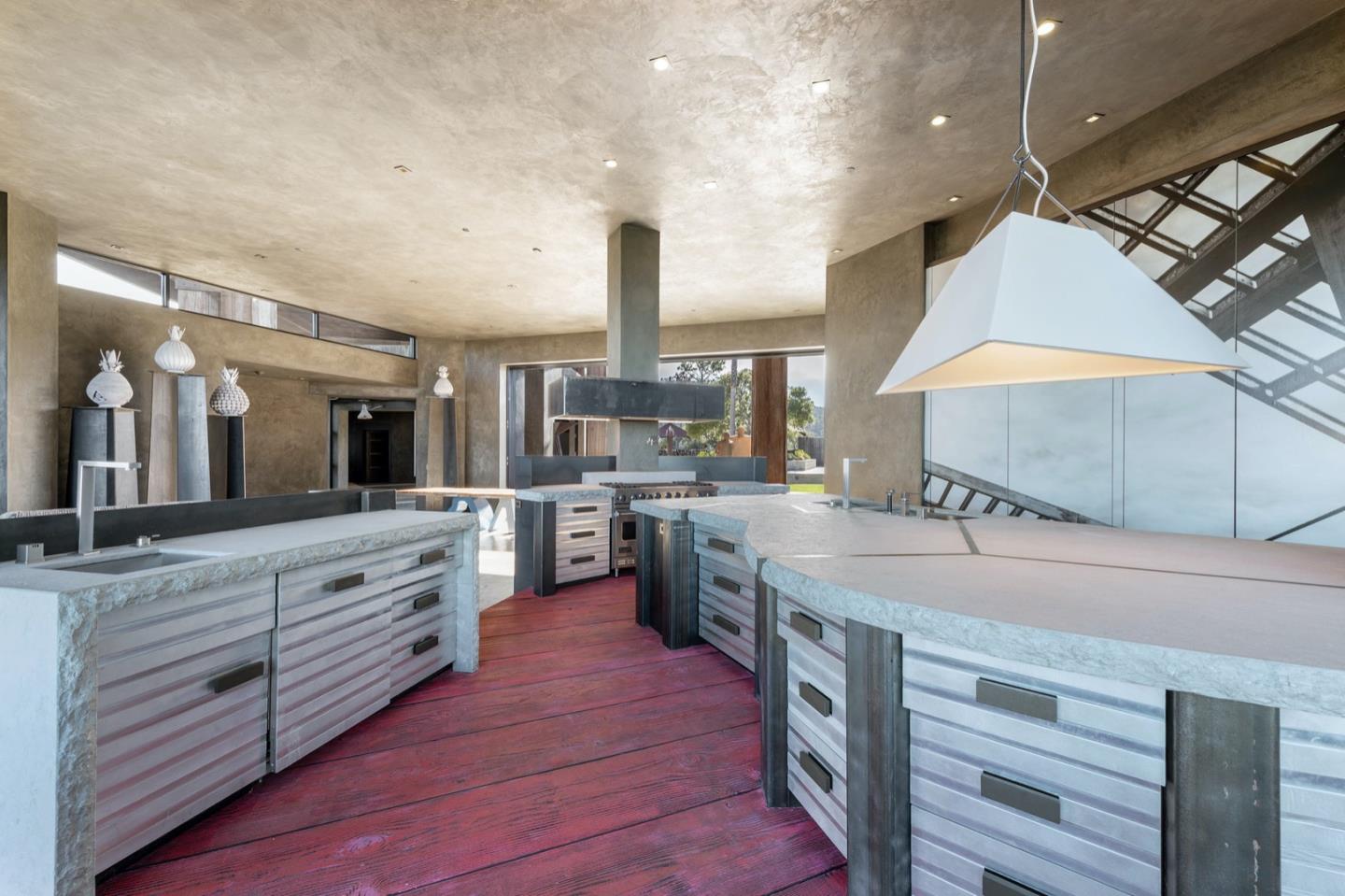 566 Aguajito Road Carmel, CA 93923 - Photo 15 of 78 a open kitchen with stainless steel appliances granite countertop a stove and cabinets
