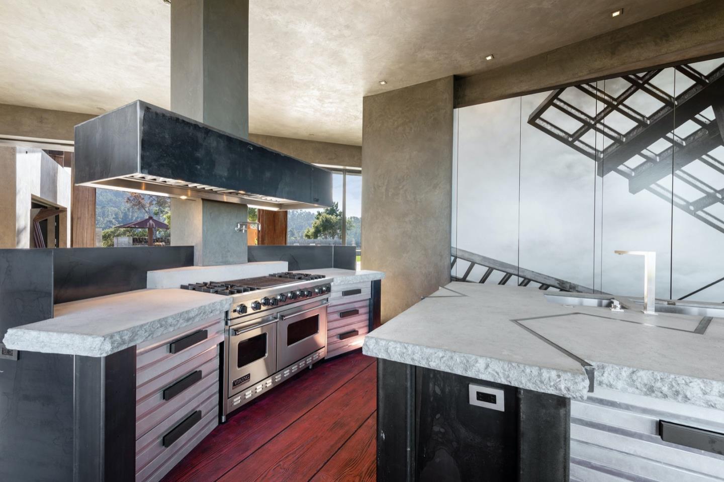 566 Aguajito Road Carmel, CA 93923 - Photo 16 of 78 a kitchen with a stove and a sink