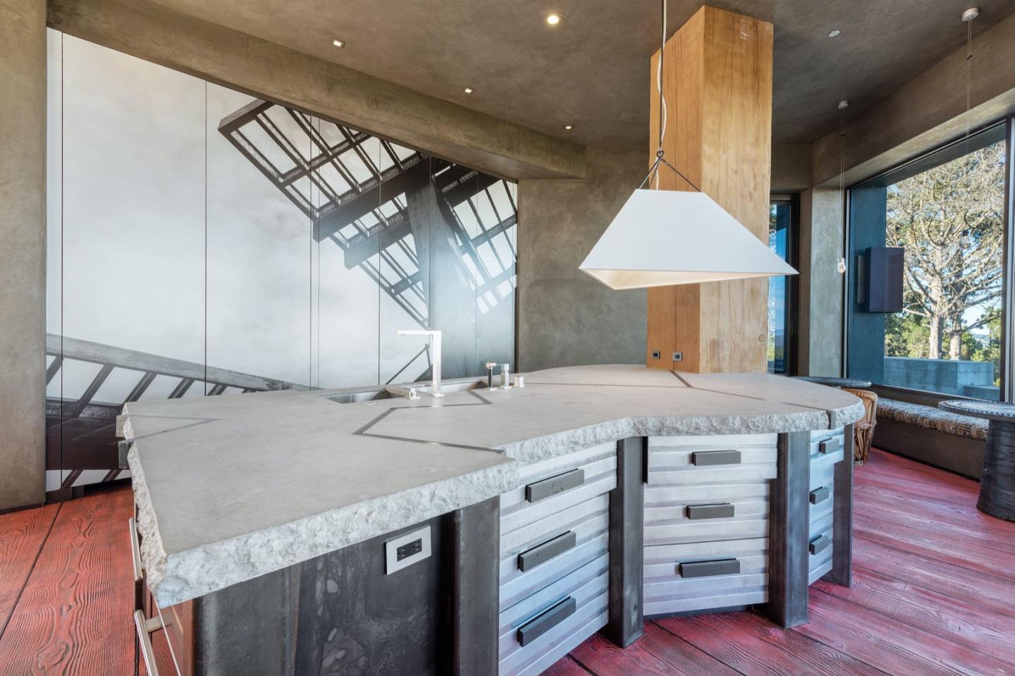 566 Aguajito Road Carmel, CA 93923 - Photo 17 of 78 a open kitchen with stainless steel appliances granite countertop a sink a stove and a wooden floors