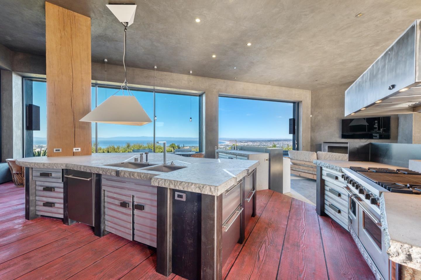 566 Aguajito Road Carmel, CA 93923 - Photo 19 of 78 a kitchen with stainless steel appliances granite countertop a stove a sink dishwasher and a refrigerator