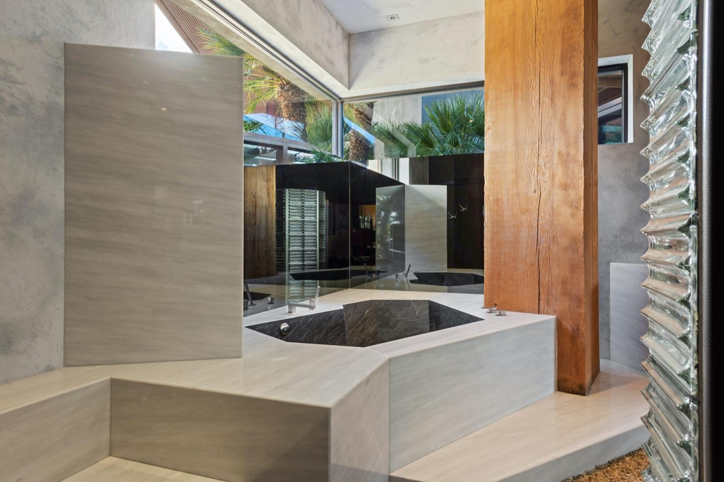 566 Aguajito Road Carmel, CA 93923 - Photo 35 of 78 a bath tub sitting in front of a window