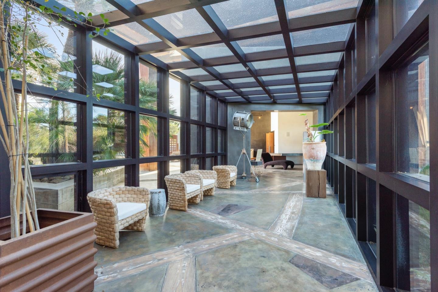 566 Aguajito Road Carmel, CA 93923 - Photo 39 of 78 a view of living room with furniture and floor to ceiling window