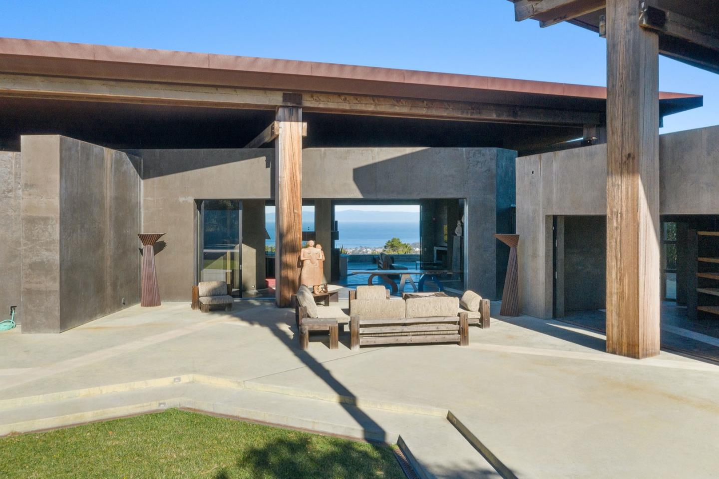 566 Aguajito Road Carmel, CA 93923 - Photo 4 of 78 a bedroom with a bed and a large window