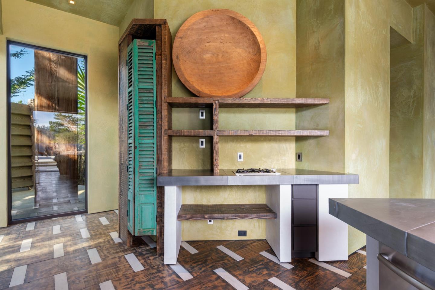566 Aguajito Road Carmel, CA 93923 - Photo 48 of 78 a view of kitchen with wooden floor and cabinets