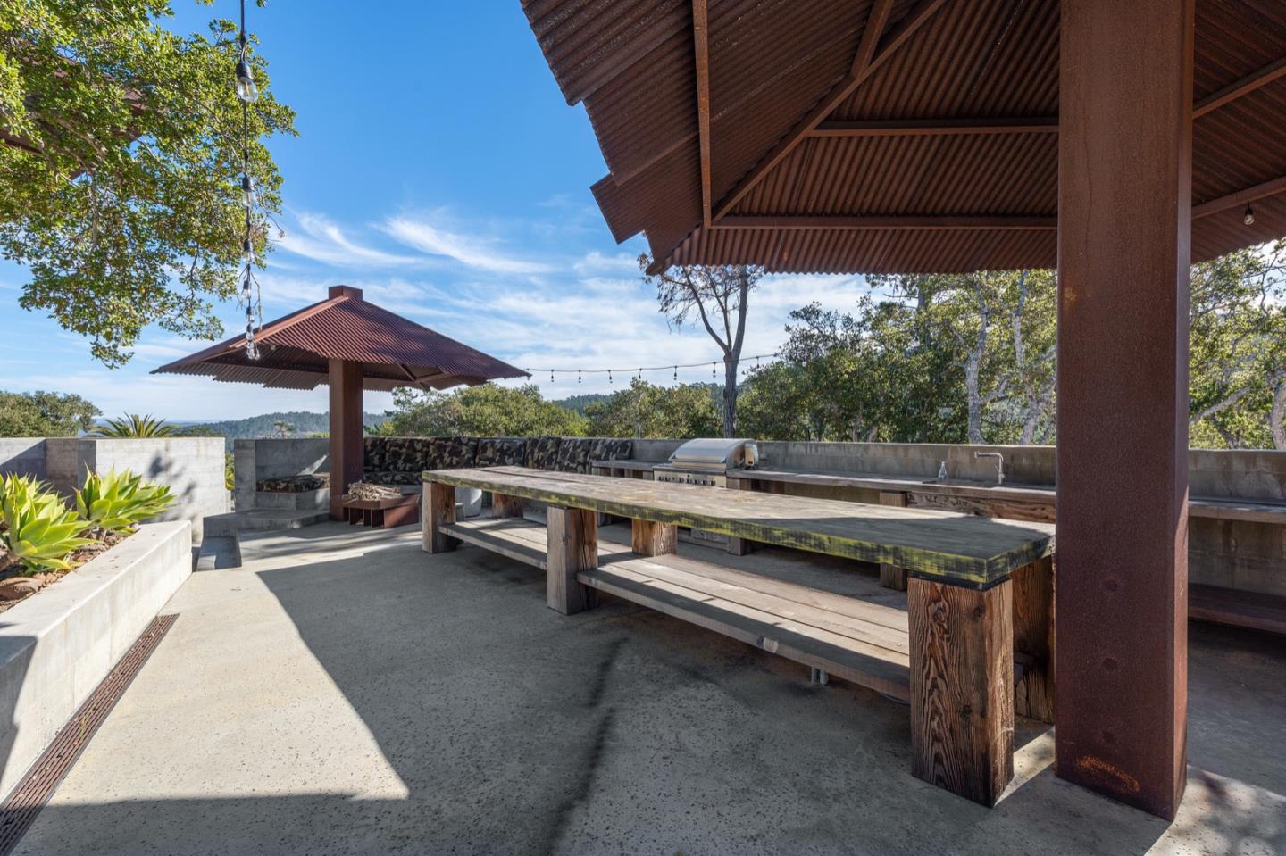 566 Aguajito Road Carmel, CA 93923 - Photo 55 of 78 a view of backyard with outdoor seating and plants