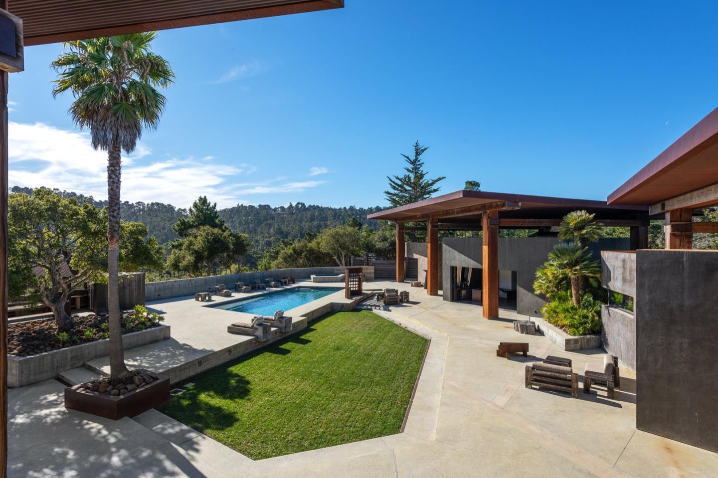 566 Aguajito Road Carmel, CA 93923 - Photo 56 of 78 a view of a house with backyard and porch