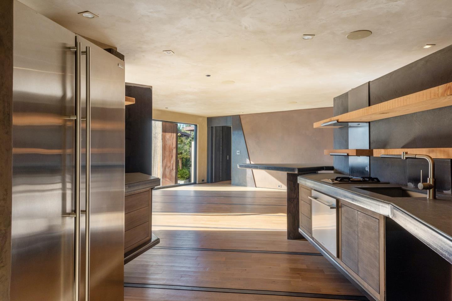 566 Aguajito Road Carmel, CA 93923 - Photo 62 of 78 a kitchen with stainless steel appliances granite countertop a refrigerator a sink and a stove