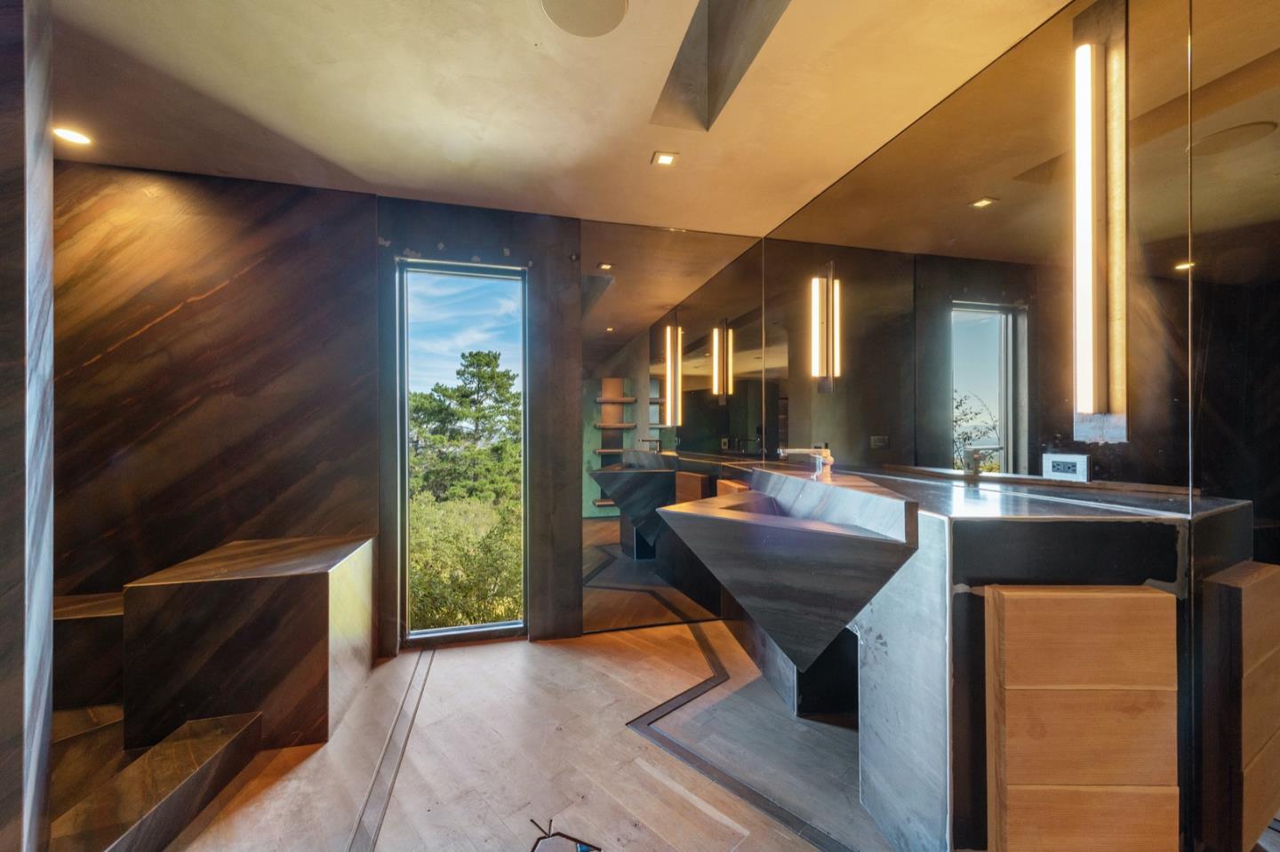 566 Aguajito Road Carmel, CA 93923 - Photo 63 of 78 a room with furniture and a potted plant