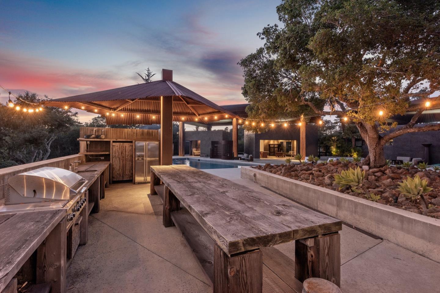 566 Aguajito Road Carmel, CA 93923 - Photo 72 of 78 a view of a patio with a table and chairs