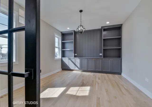 a view of an empty room with a cabinet