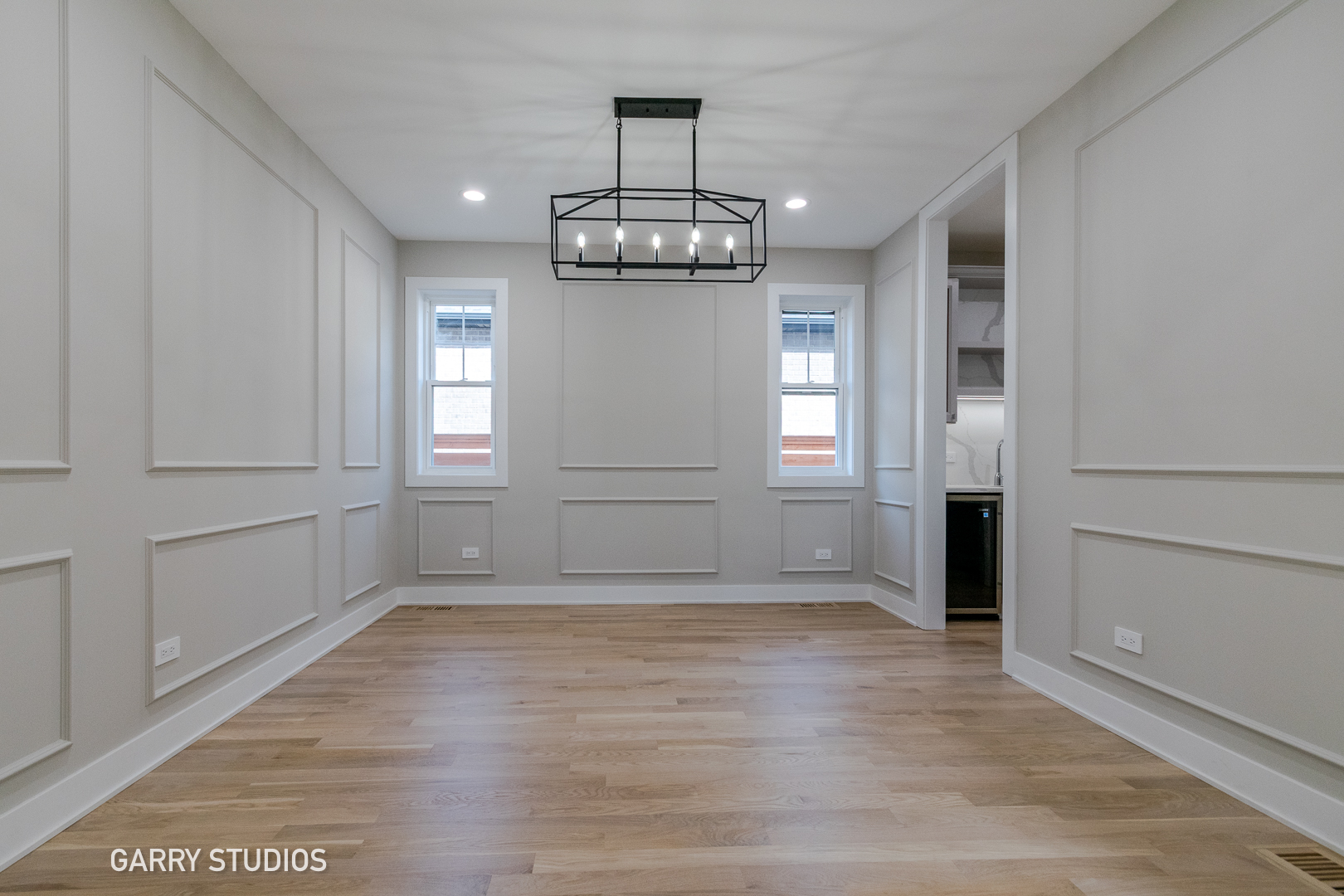 15W320 Concord Street Elmhurst, IL 60126 - Photo 6 of 20 an empty room with wooden floor cabinet and windows
