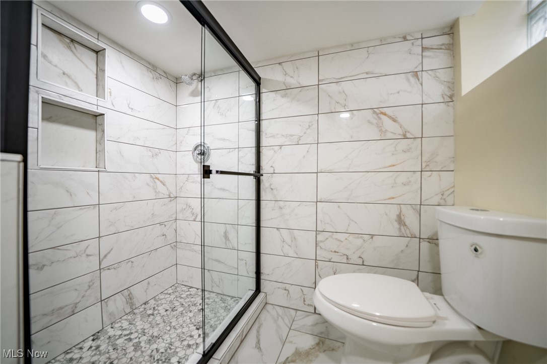 3816 Summit Park Road Cleveland Heights, OH 44121 - Photo 27 of 35 Bathroom featuring marble look tile flooring, a stall shower, and recessed lighting