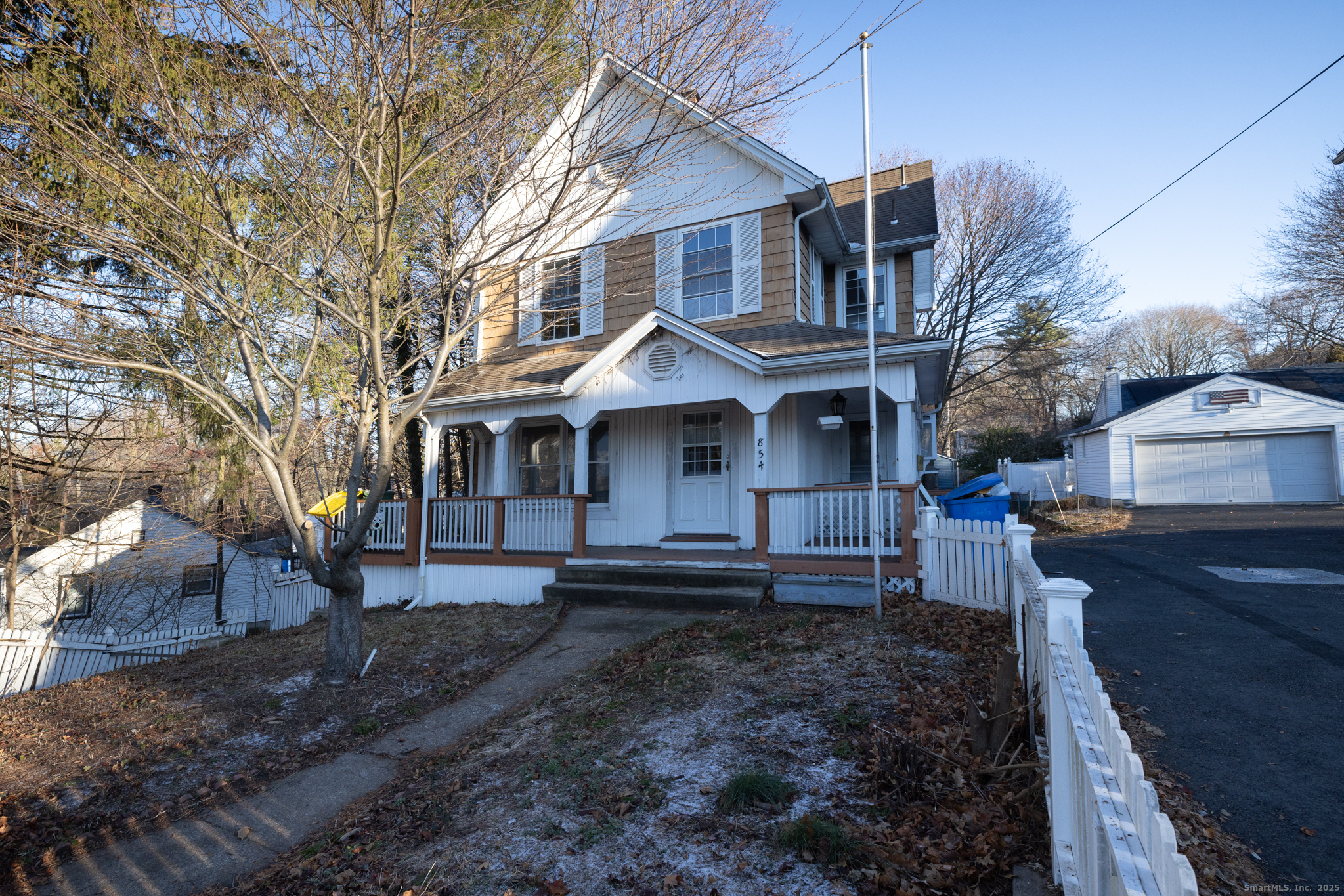 854 Frost Road Waterbury, CT 06705 - Photo 1 of 1 a front view of a house with a yard
