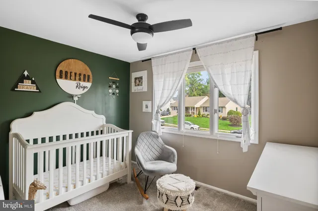 a bathroom with a sink a toilet and a window