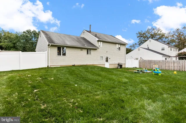 a view of backyard with a garden and entertaining space