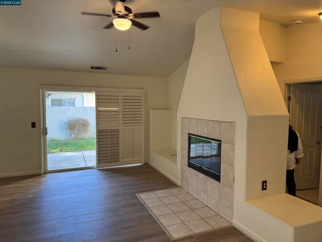 wooden floor in an empty room with a fireplace