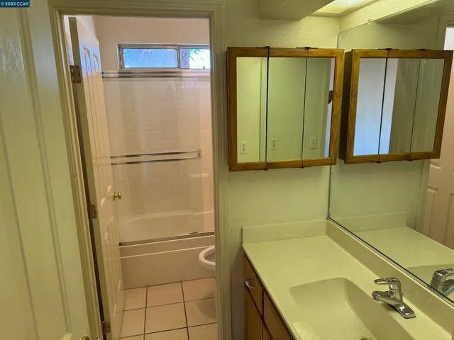 a bathroom with a sink and a shower