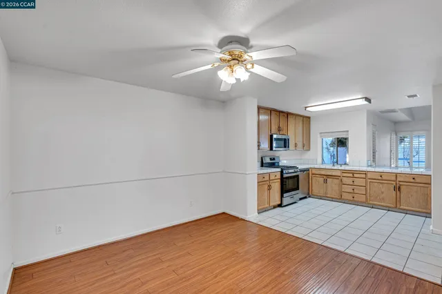 a kitchen with stainless steel appliances granite countertop a sink and cabinets