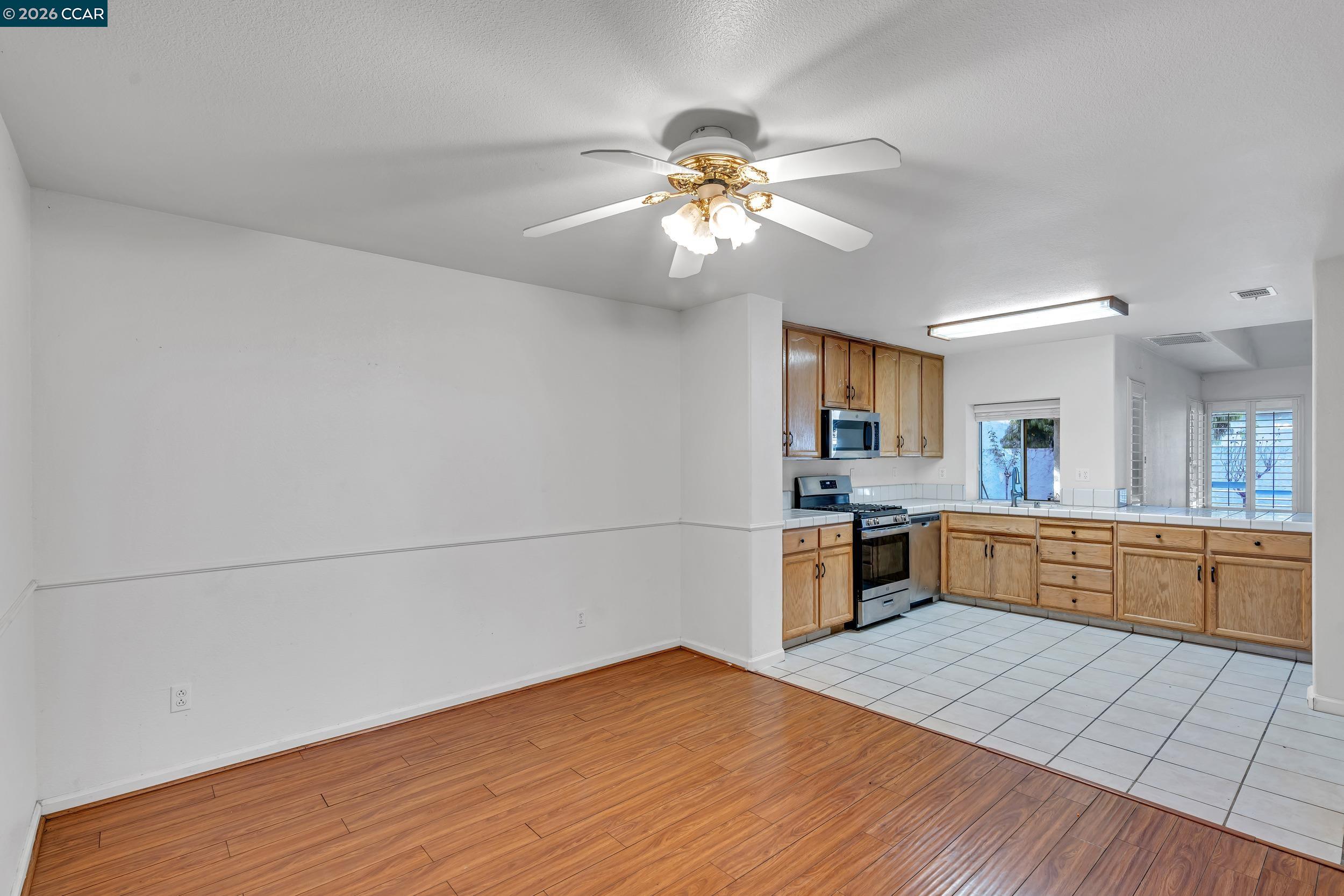 3735 Ignacio Circle Stockton, CA 95209 - Photo 21 of 22 a kitchen with a refrigerator and a stove top oven