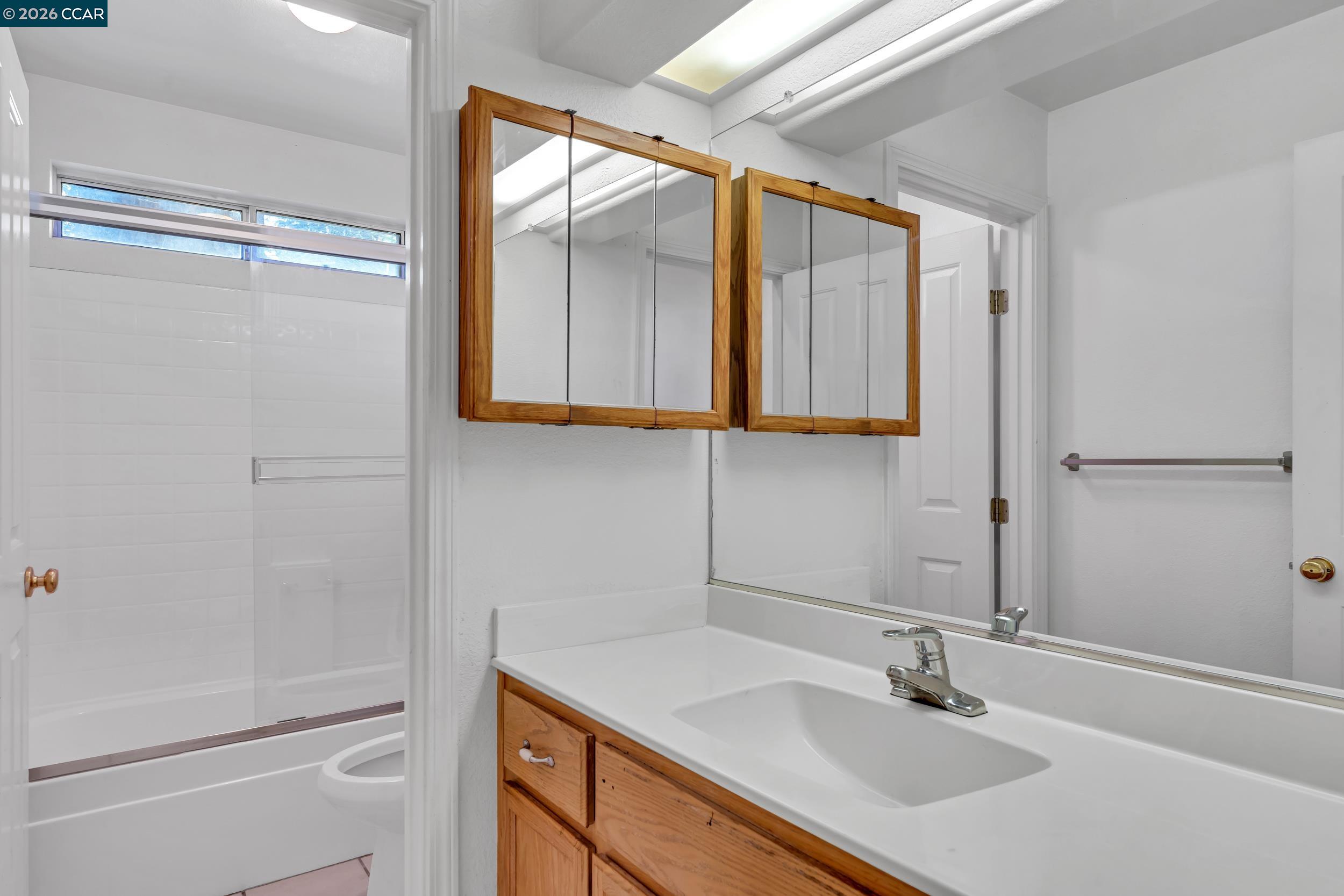 3735 Ignacio Circle Stockton, CA 95209 - Photo 5 of 22 a bathroom with a sink and a large mirror