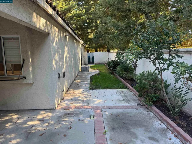 a backyard of a house with lots of green space