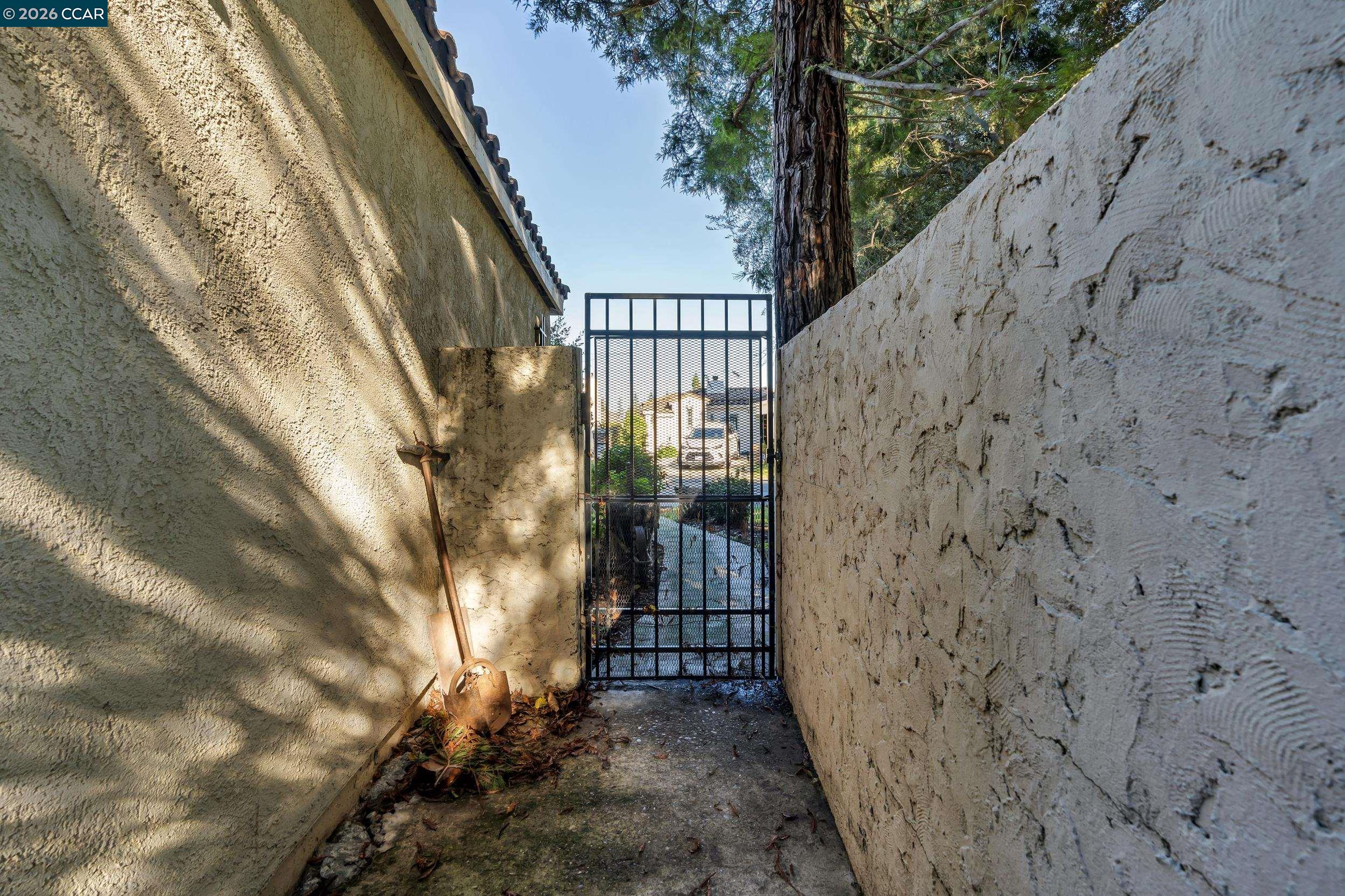 3735 Ignacio Circle Stockton, CA 95209 - Photo 10 of 22 a view of a pathway of a building with wooden stairs and bench