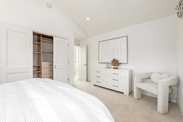 a bathroom with a granite countertop sink and a large mirror