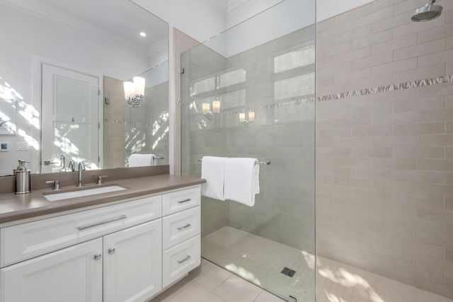 a large white bed in a white room