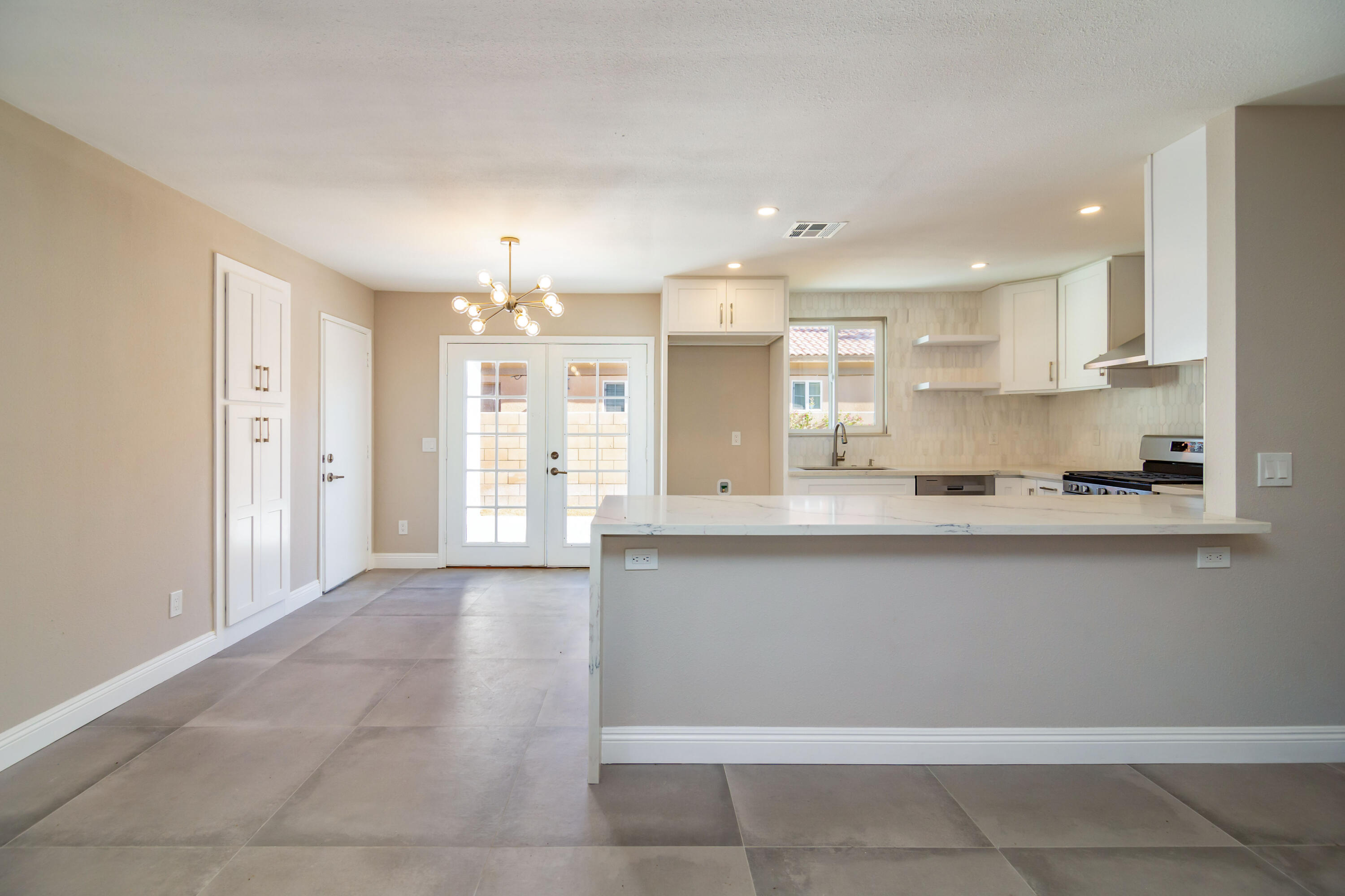 52880 Avenida Navarro La Quinta, CA 92253 - Photo 11 of 27 a large kitchen with granite countertop a large counter top stainless steel appliances and cabinets