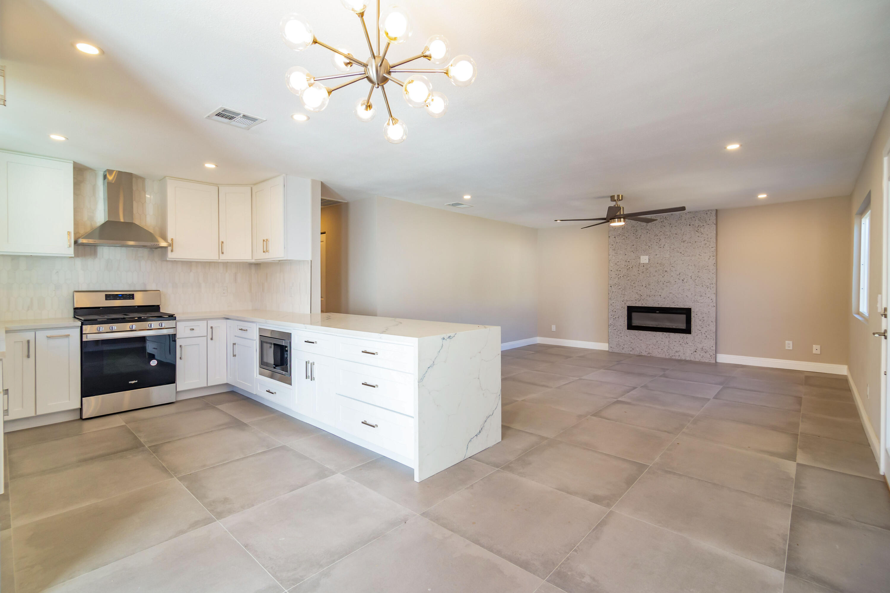 52880 Avenida Navarro La Quinta, CA 92253 - Photo 12 of 27 a large kitchen with cabinets and stainless steel appliances