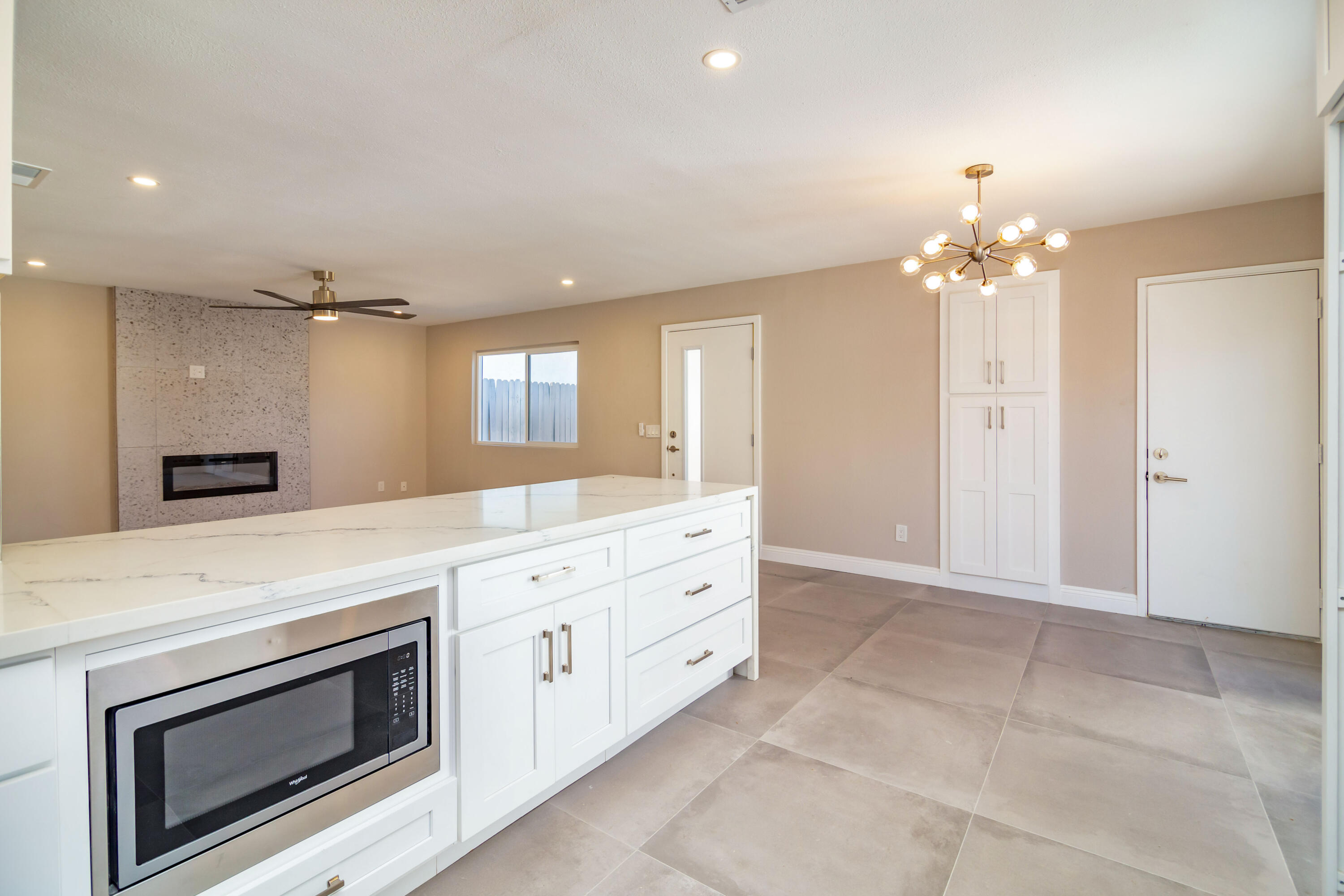 52880 Avenida Navarro La Quinta, CA 92253 - Photo 14 of 27 a view of a kitchen with a sink and a fireplace