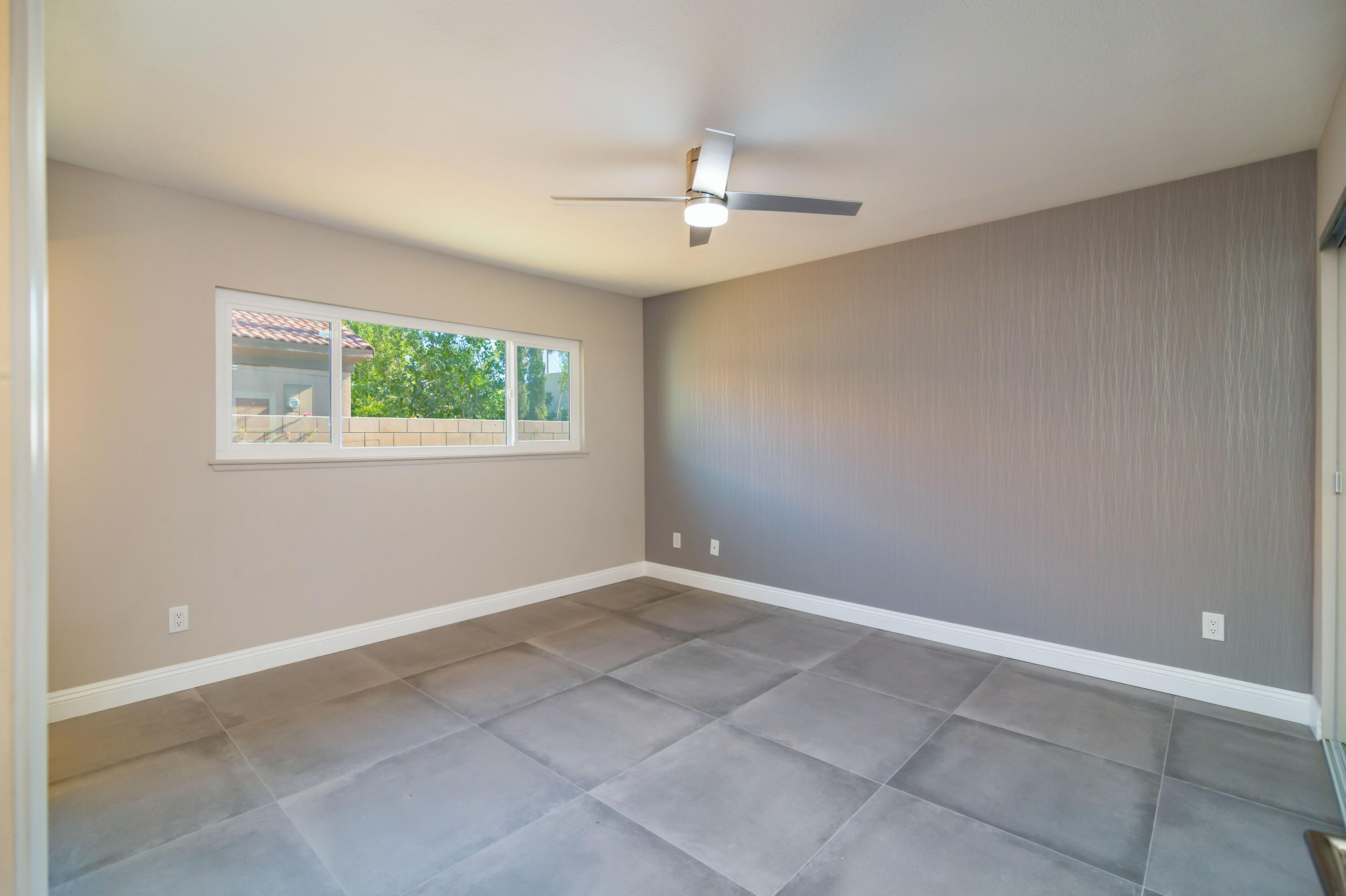 52880 Avenida Navarro La Quinta, CA 92253 - Photo 18 of 27 an empty room with windows and fan