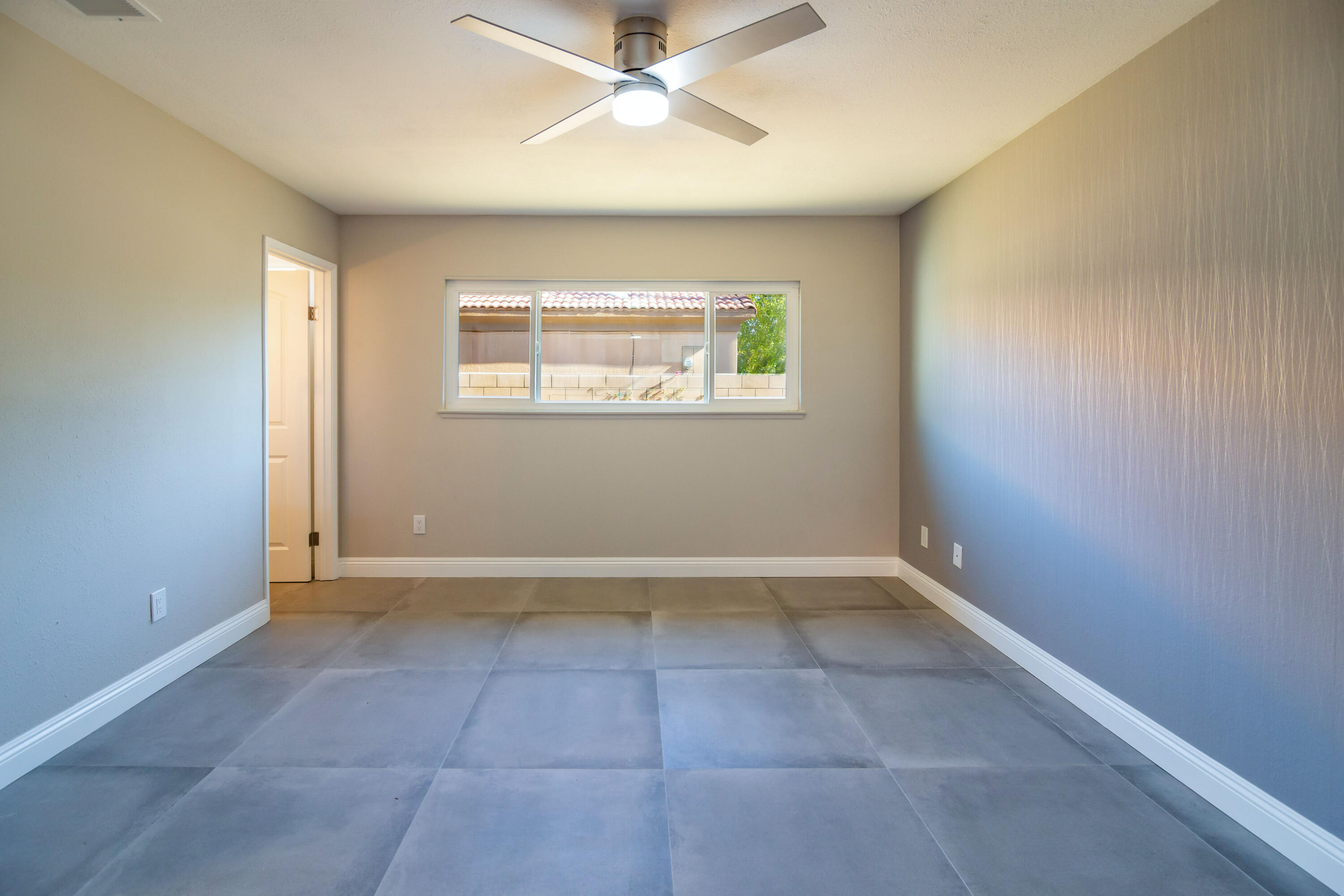 52880 Avenida Navarro La Quinta, CA 92253 - Photo 20 of 27 an empty room with windows and fan