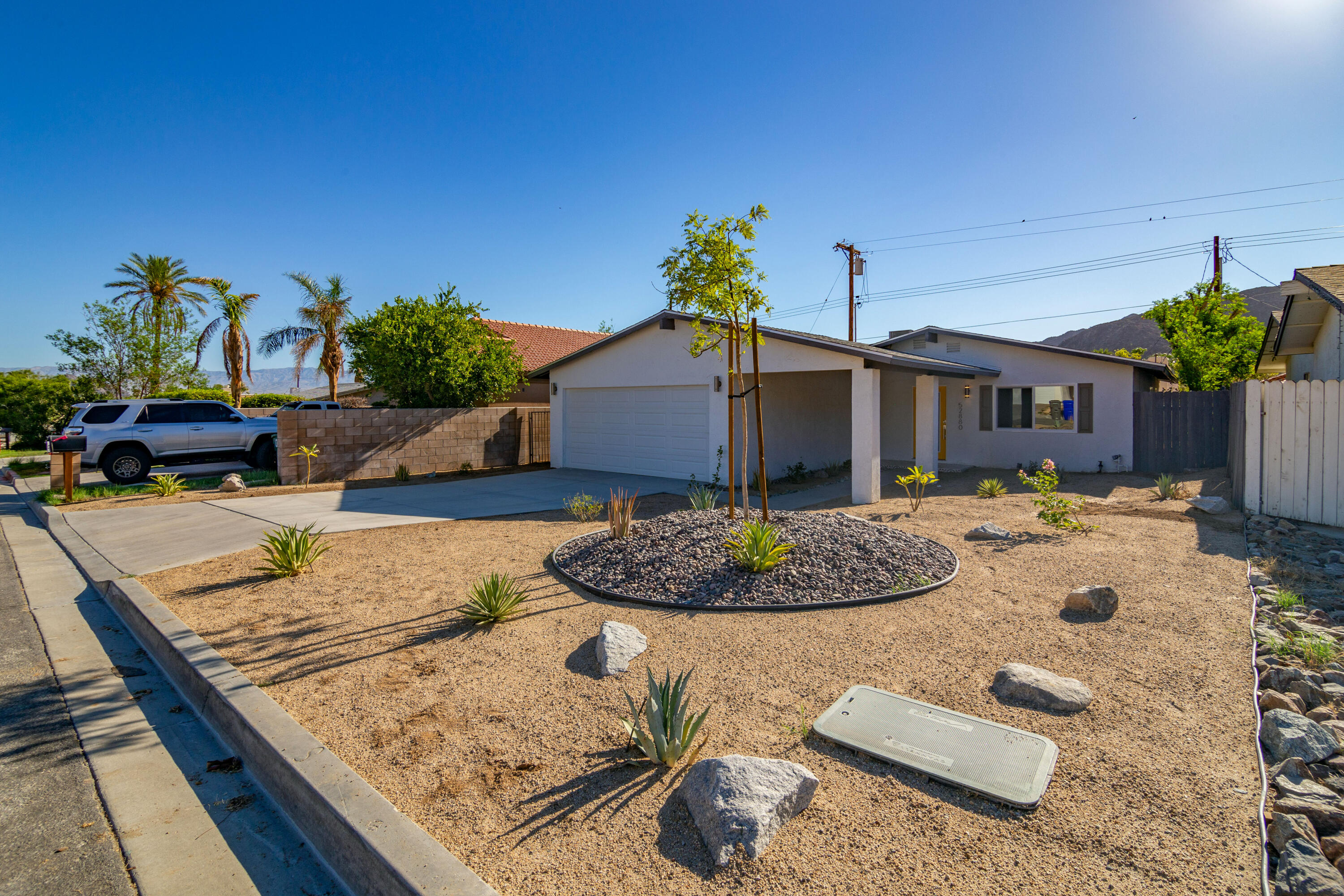 52880 Avenida Navarro La Quinta, CA 92253 - Photo 2 of 27 a view of a house with backyard and sitting area