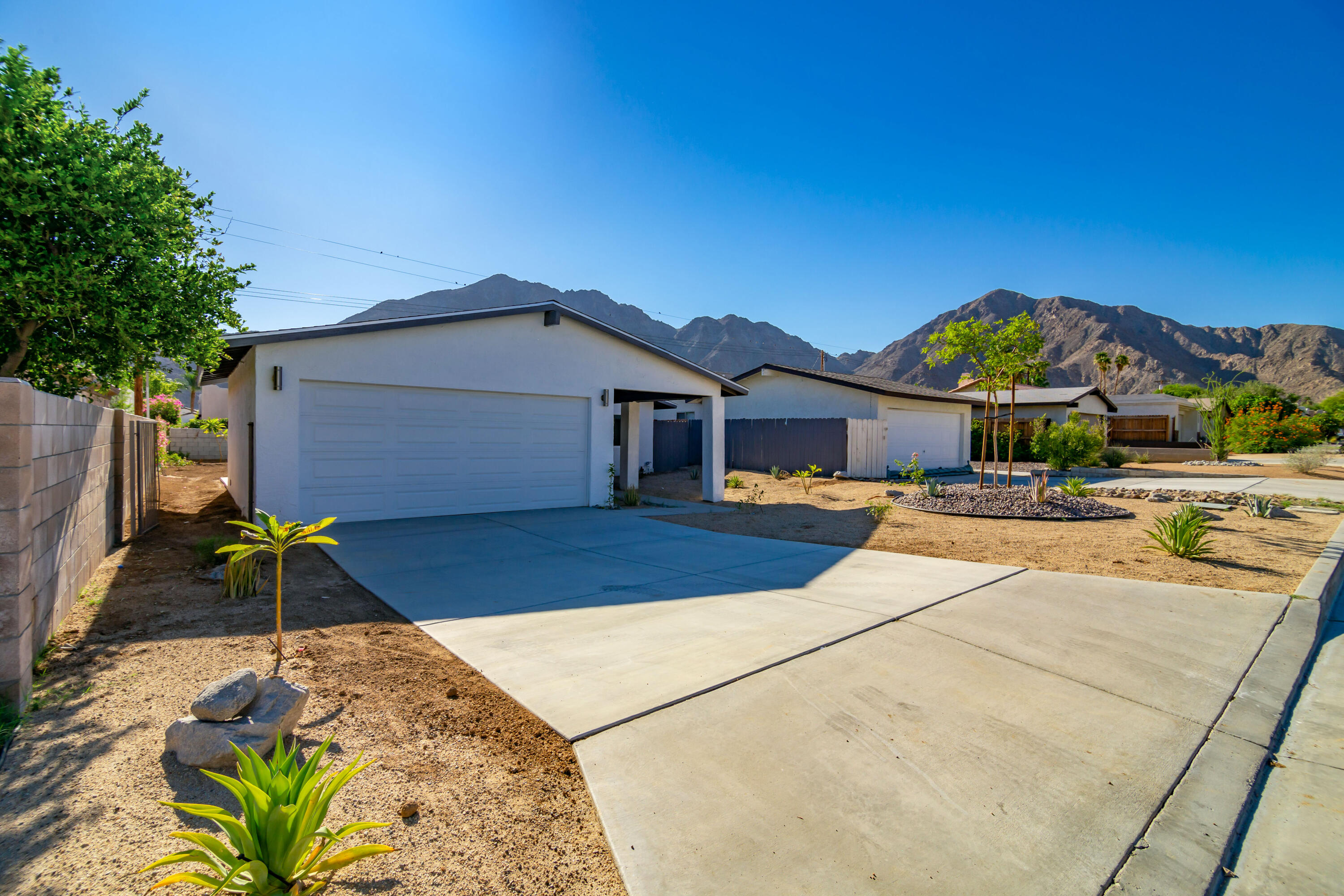 52880 Avenida Navarro La Quinta, CA 92253 - Photo 3 of 27 a front view of house with yard outdoor seating and entertaining space