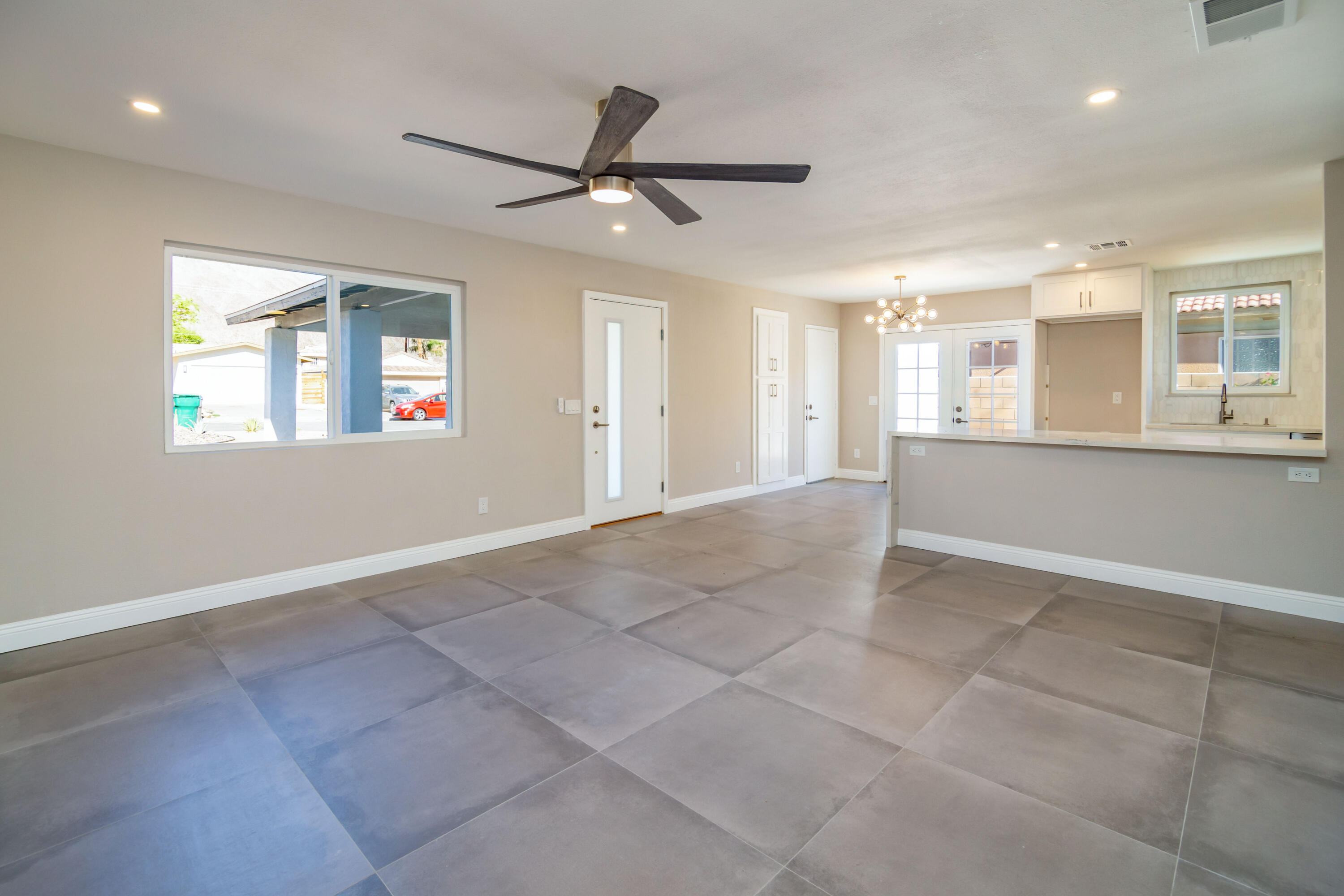 52880 Avenida Navarro La Quinta, CA 92253 - Photo 6 of 27 a view of a livingroom with a ceiling fan and windows